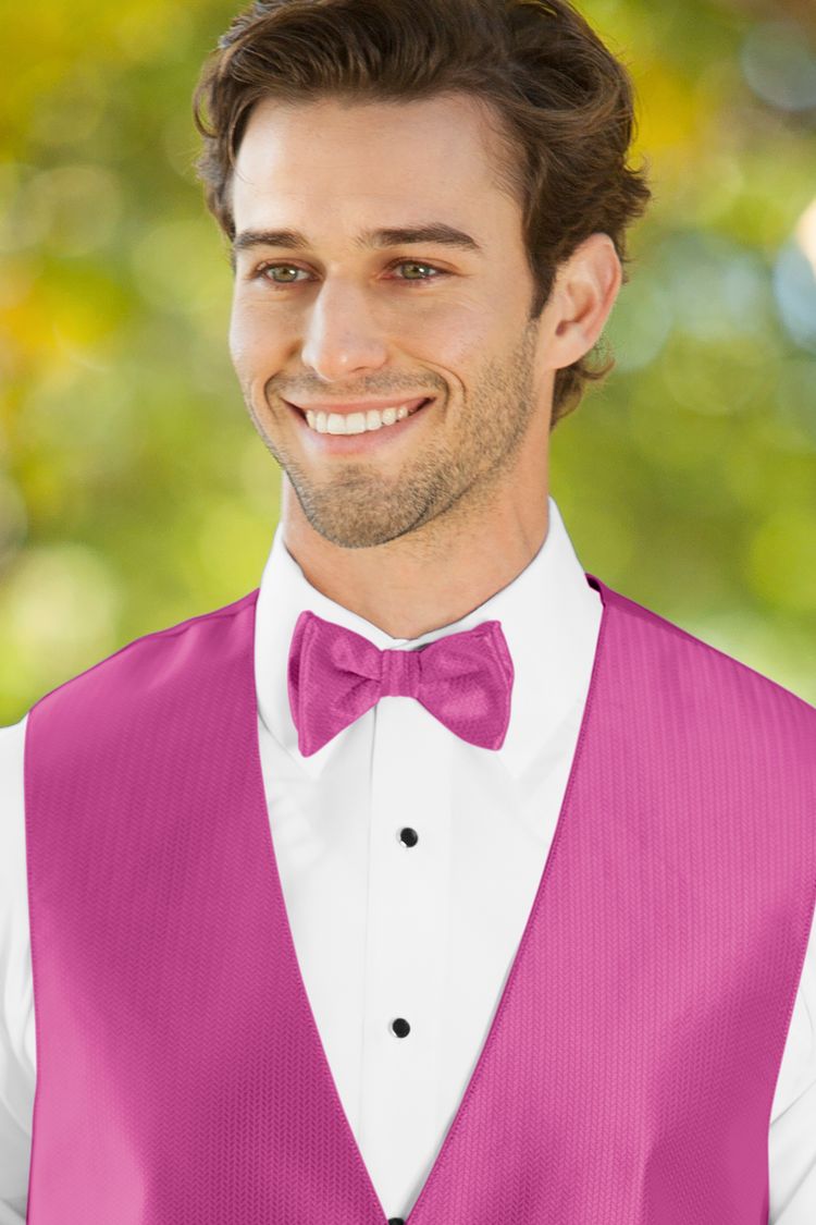 Man wearing the Herringbone Begonia Bow Tie with a matching vest