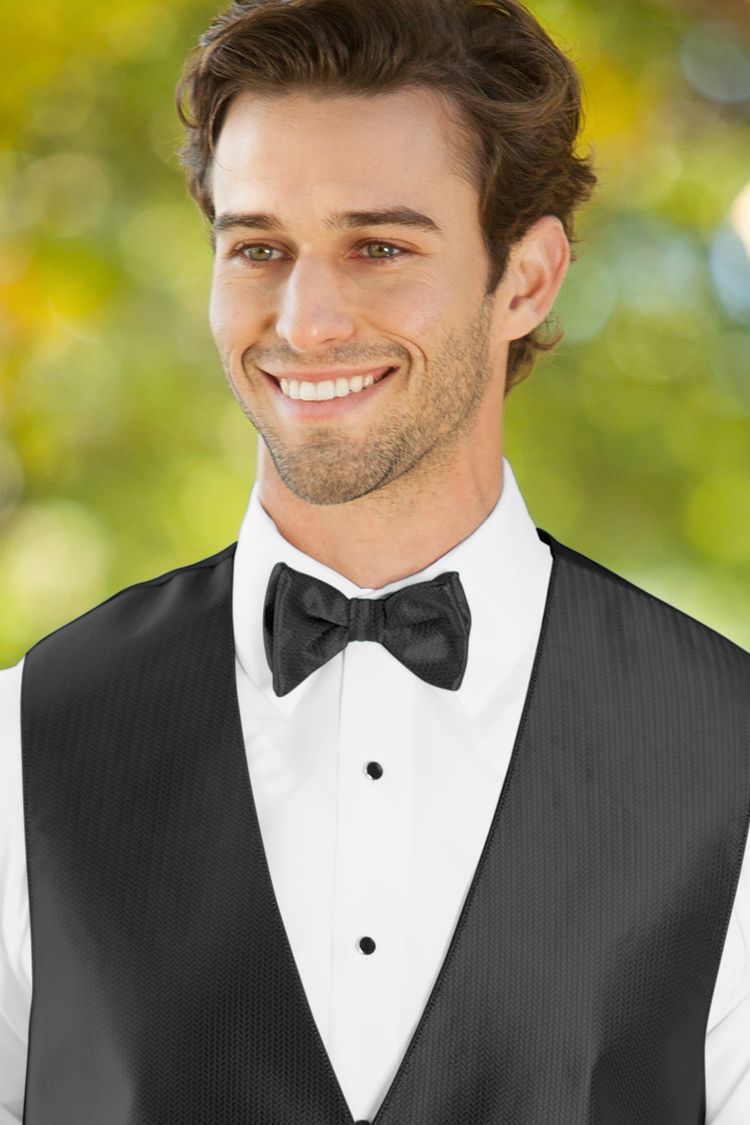 Man wearing the Herringbone Black Bow Tie with a matching vest