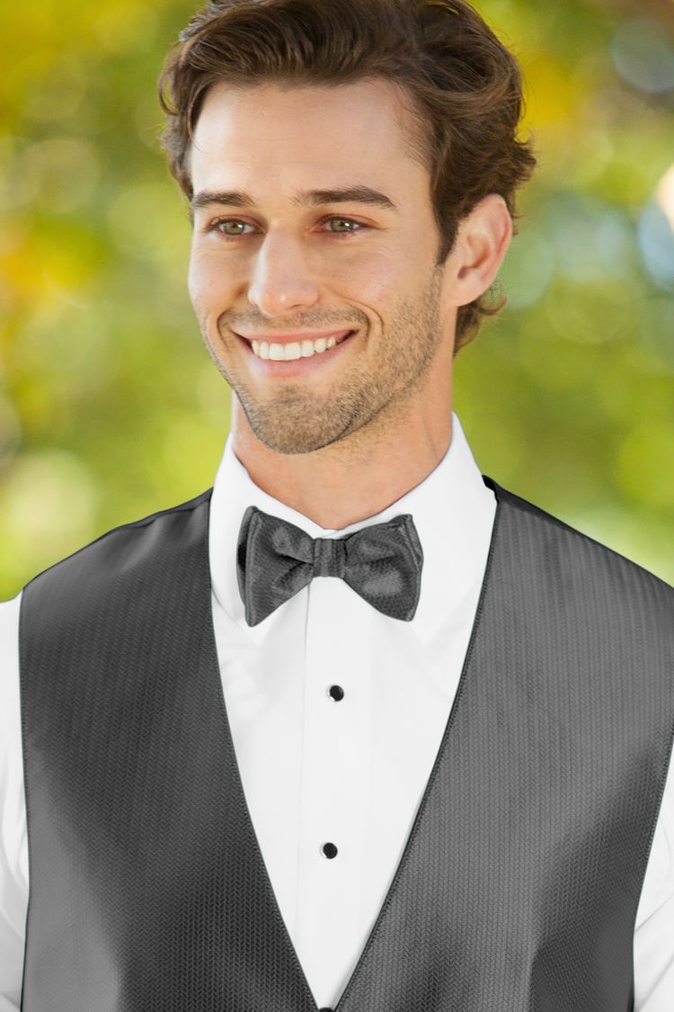 Man wearing the Herringbone Charcoal Bow Tie with a matching vest
