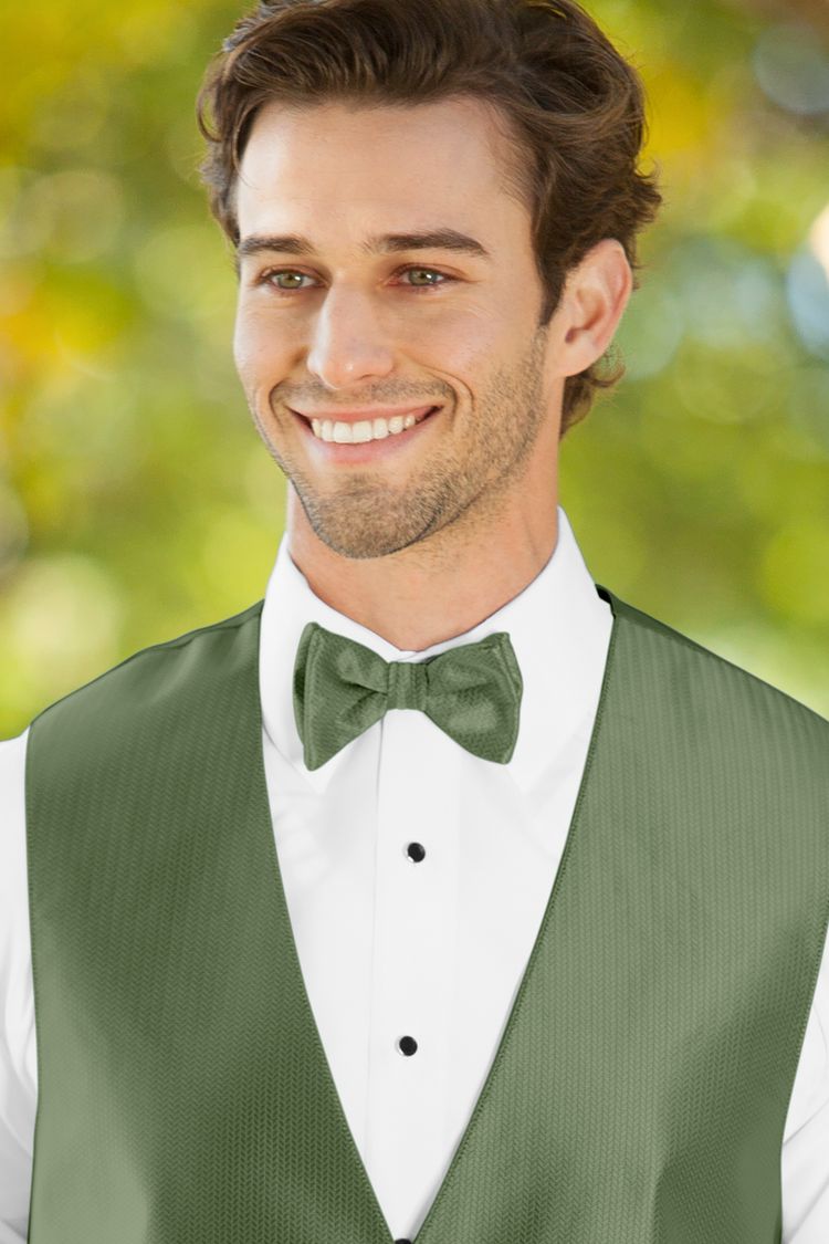 Man wearing the Herringbone Clover Bow Tie with a matching vest