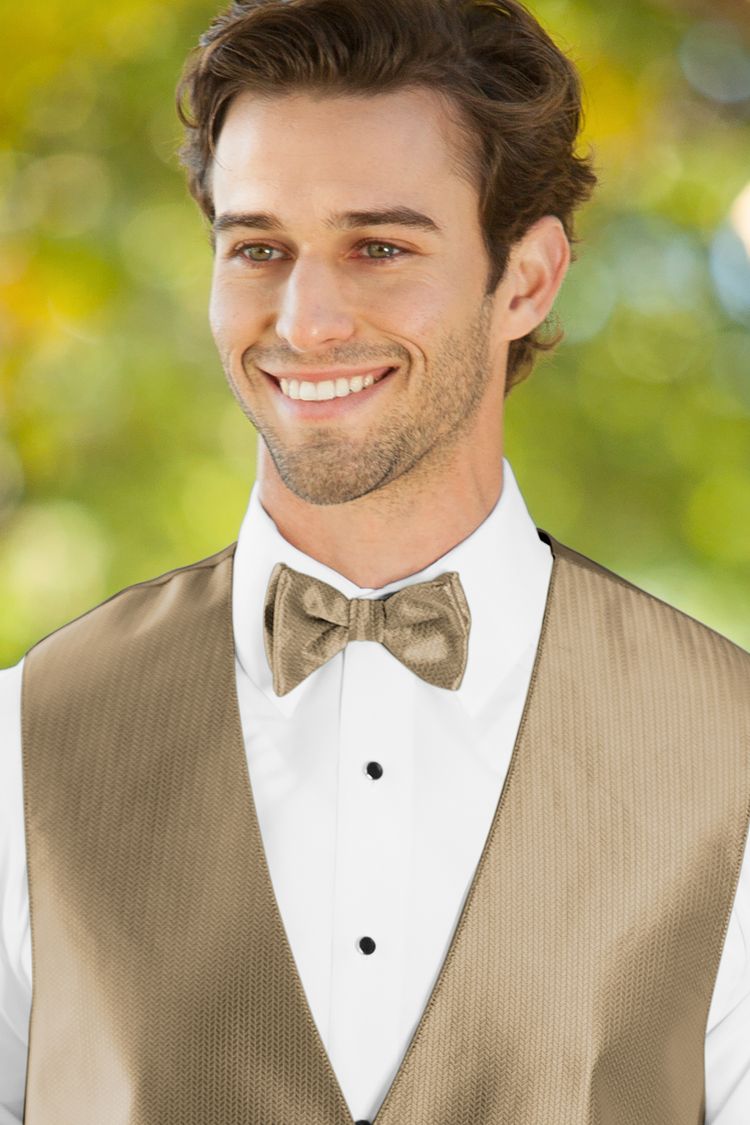 Man wearing the Herringbone Gold Bow Tie with a matching vest