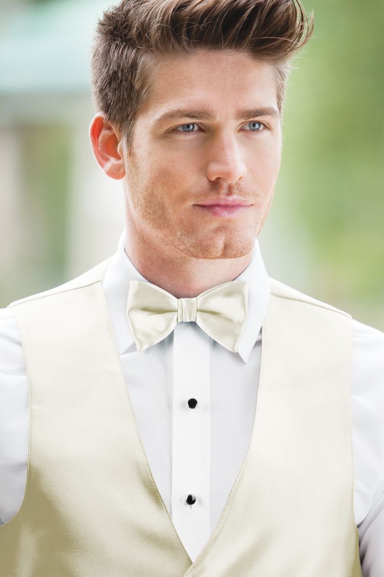Guy wearing the Expressions Ivory Bow Tie and matching vest