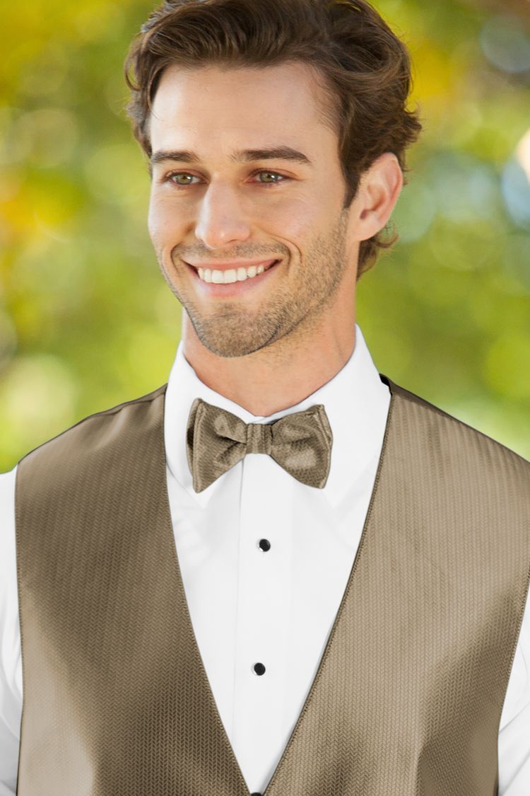 Man wearing the Herringbone Latte Bow Tie with a matching vest