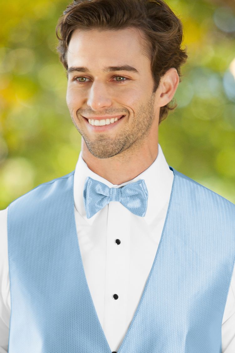 Man wearing the Herringbone Lite Blue Bow Tie with a matching vest