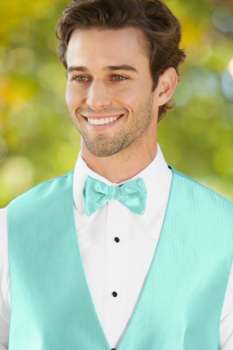 Man wearing the Herringbone Pool Bow Tie with a matching vest