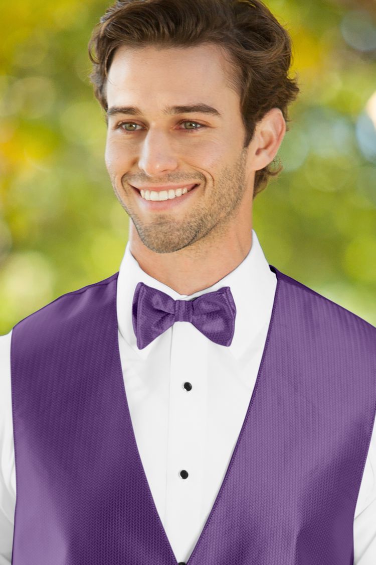 Man wearing the Herringbone Purple Bow Tie with a matching vest