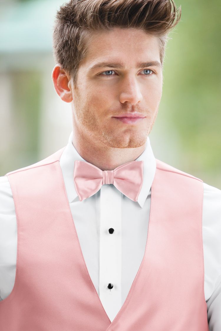 Man wearing the Expressions Rose Petal Bow Tie with a matching vest
