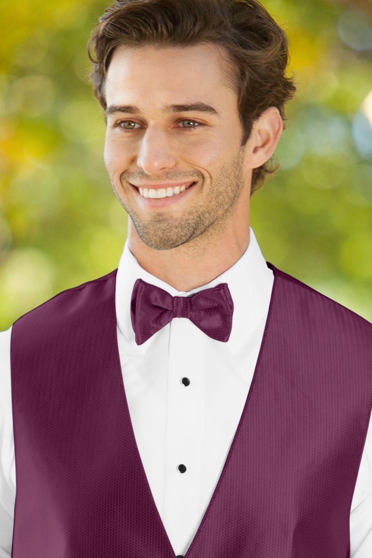 Man wearing the Herringbone Sangria Bow Tie with a matching vest