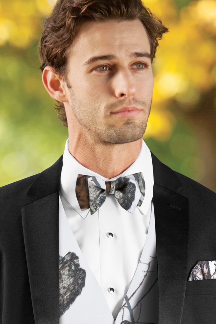 Guy wearing the Mossy Oak White Camouflage Bow Tie with a matching vest