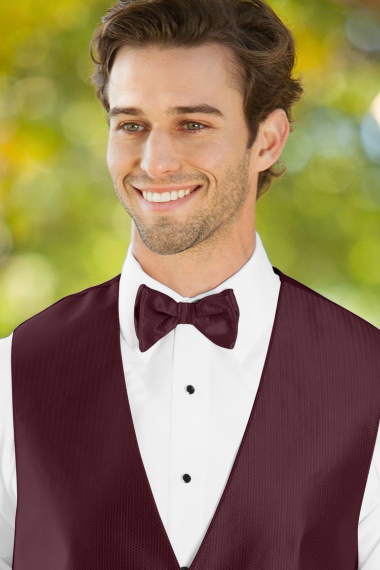 Man wearing the Herringbone Wine Bow Tie with a matching vest