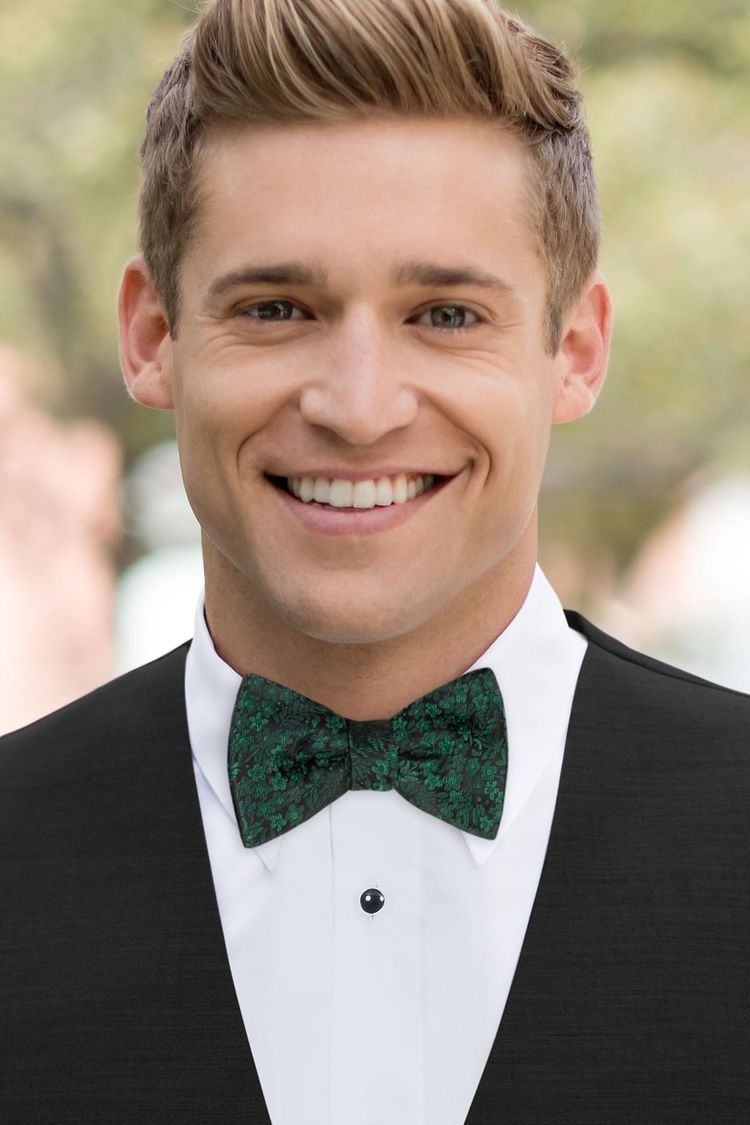Man wearing a Floral Dark Green Bow Tie with a black vest