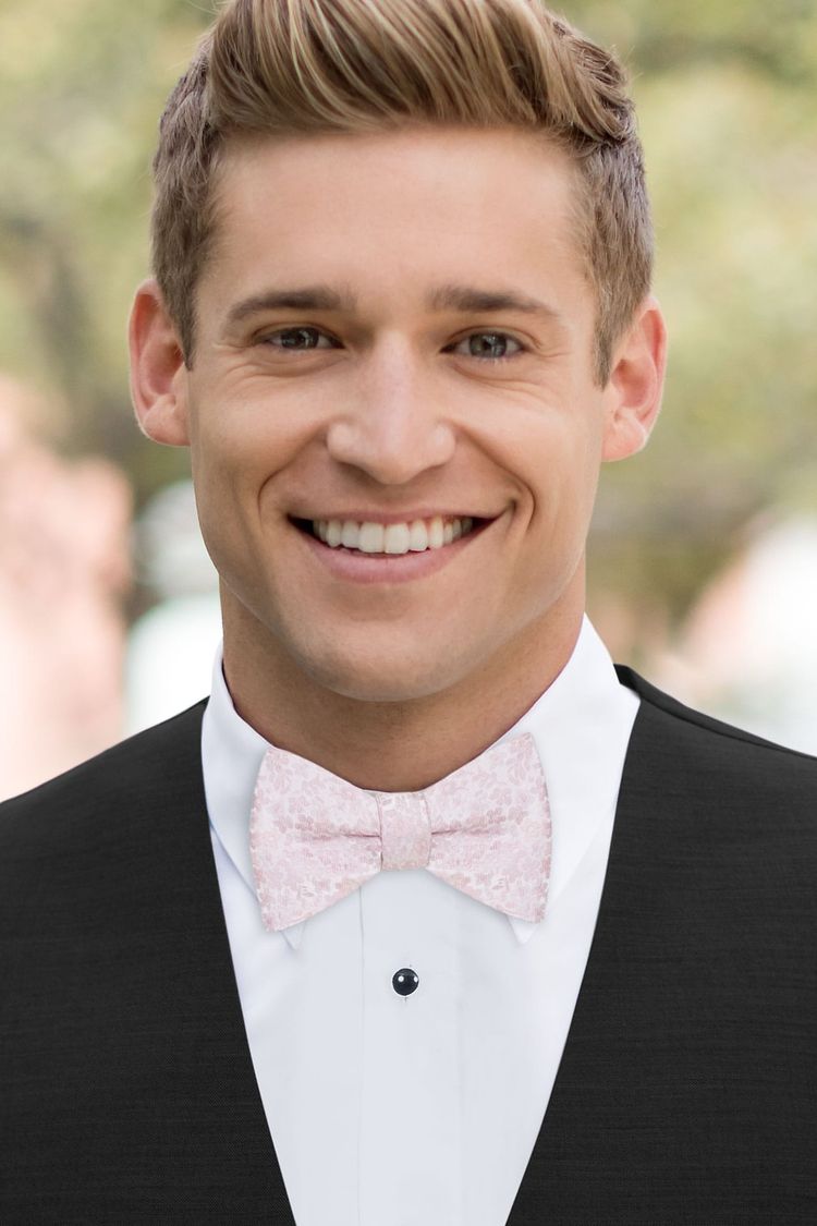 Man wearing a Floral Dusty Rose Bow Tie with a black vest