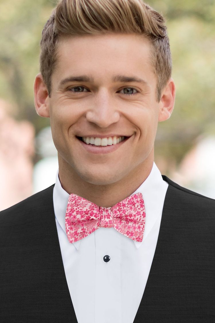 Man wearing a Floral Fuchsia Bow Tie with a black vest