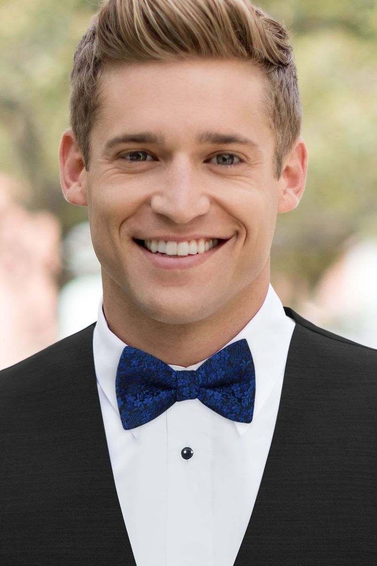 Guy wearing a Floral Royal Blue Bow Tie with a black vest