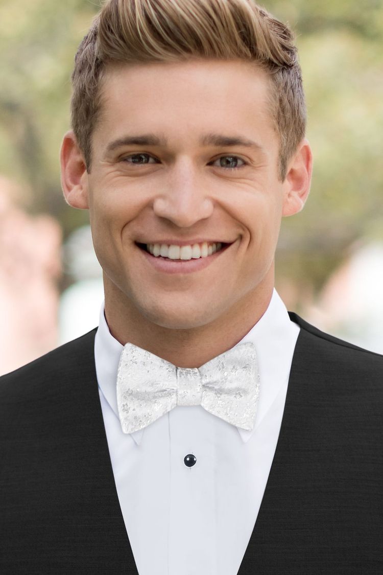 Man wearing Floral Silver Metallic Bow Tie with a black vest