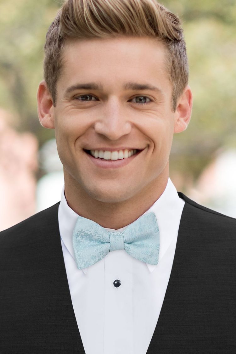 Guy wearing a Floral Sky Blue Bow Tie with a black vest