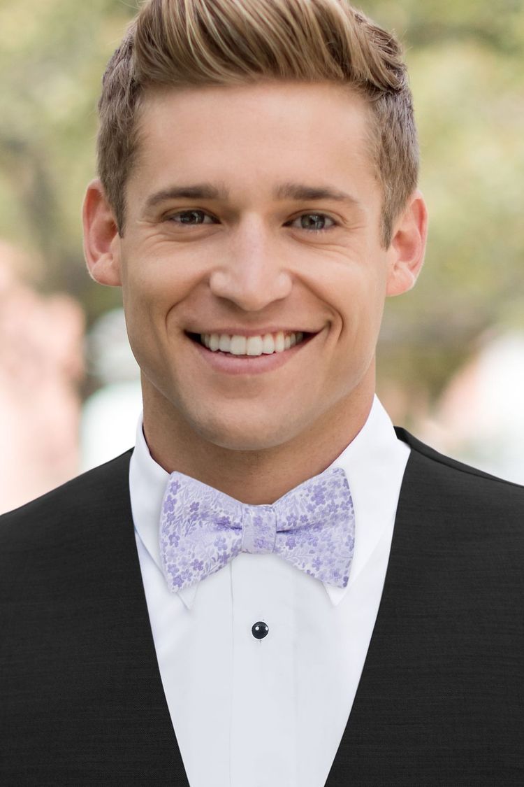 Guy wearing a Floral Violet Bow Tie in a black vest