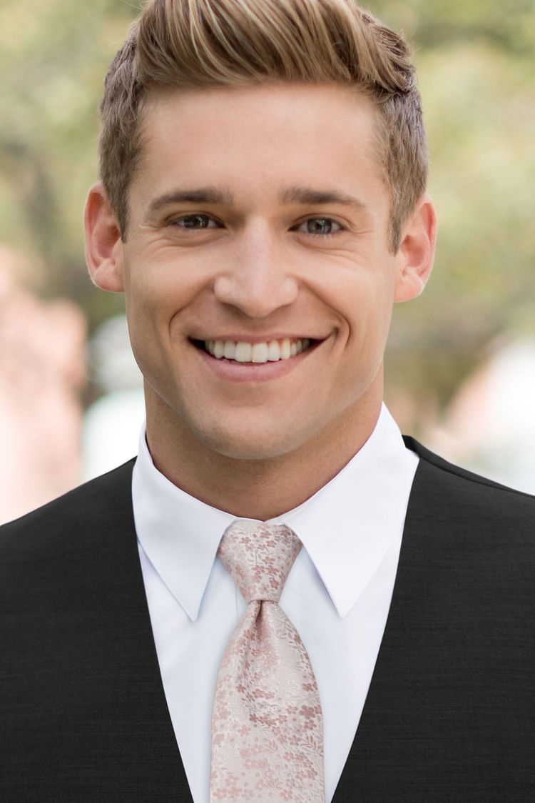 Man wearing a Floral Blush Windsor Tie with a black vest