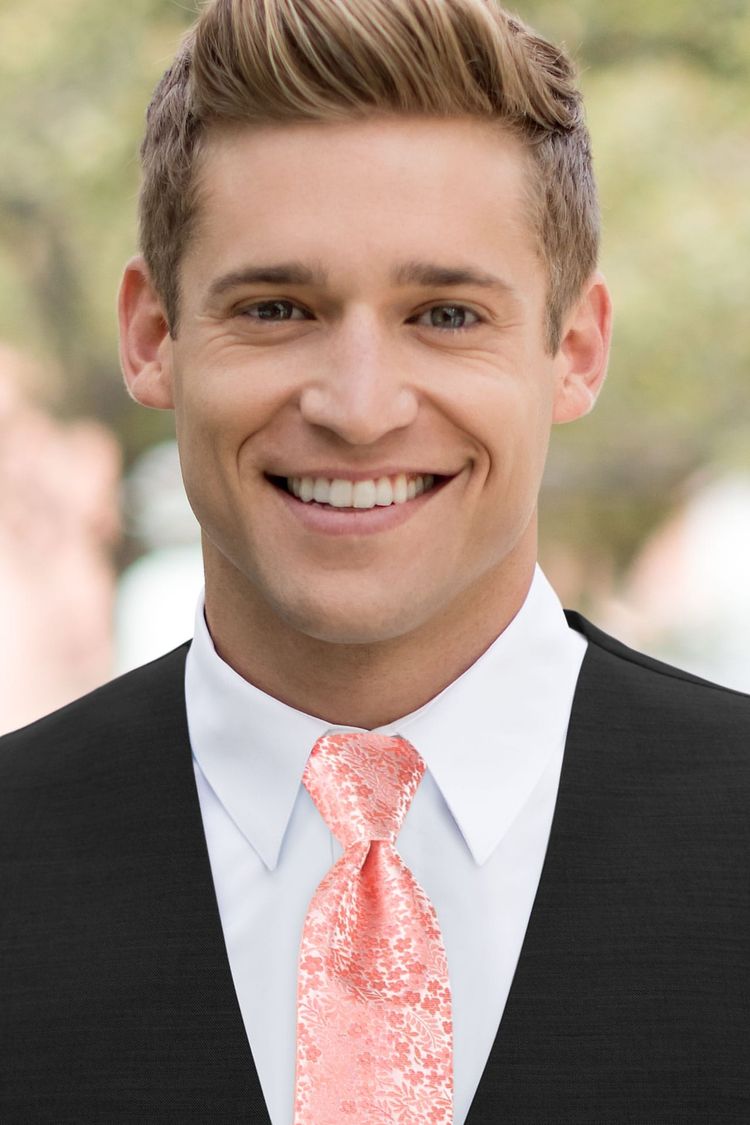 Man wearing a Floral Dark Coral Windsor Tie with a black vest