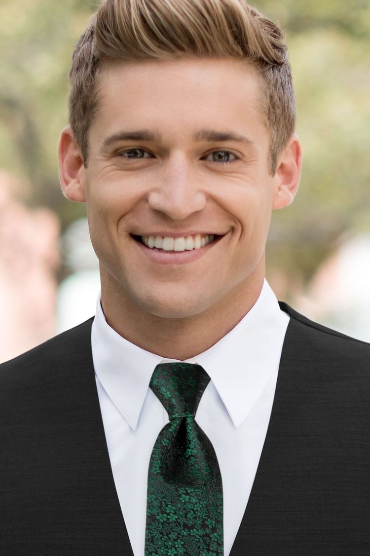 Man wearing a Floral Dark Green Windsor Tie with a black vest