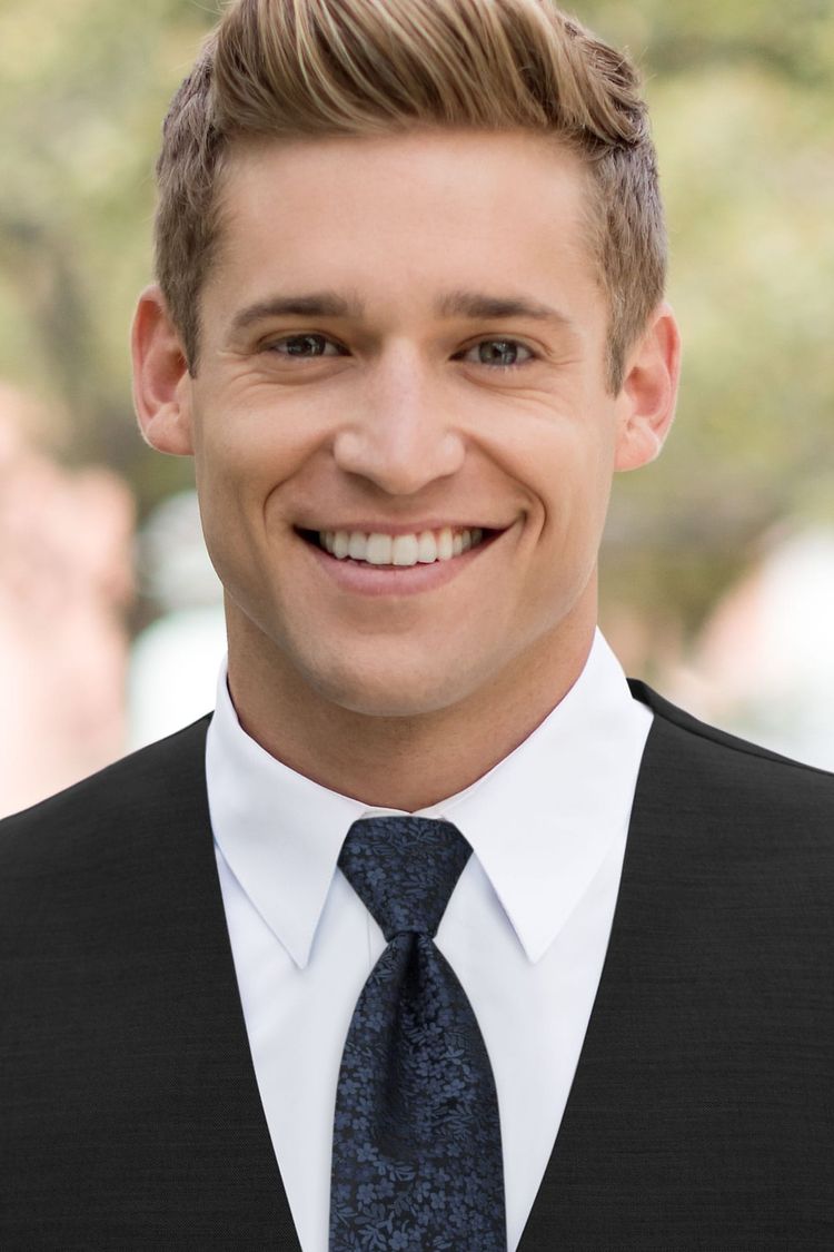 Man wearing a Floral Navy Windsor Tie with a black vest