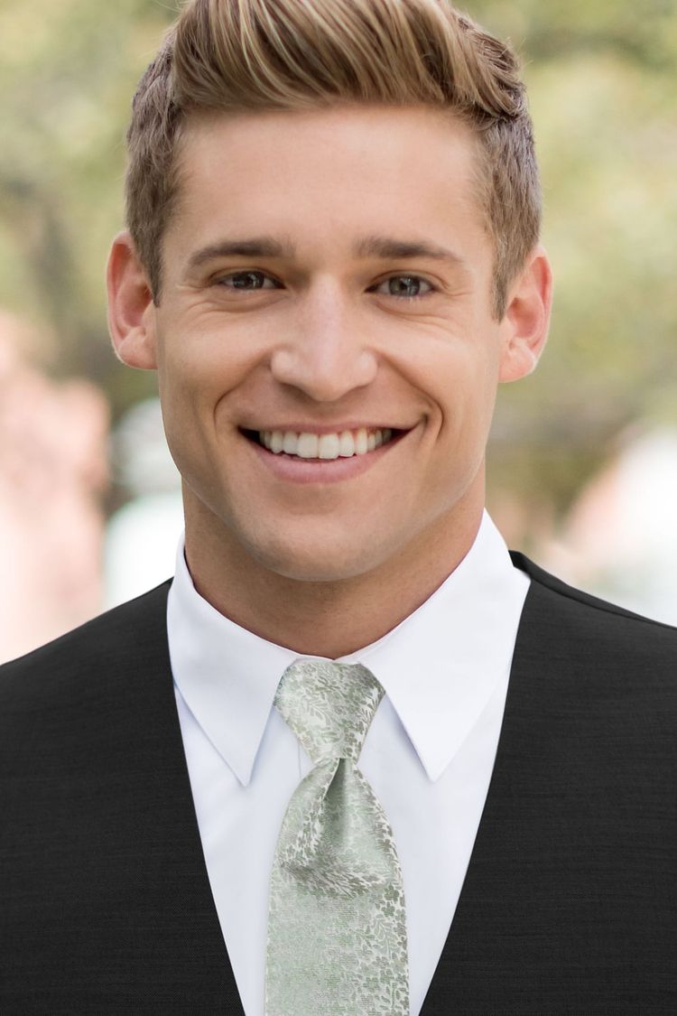 Man wearing a Floral Sage Windsor Tie with a black vest