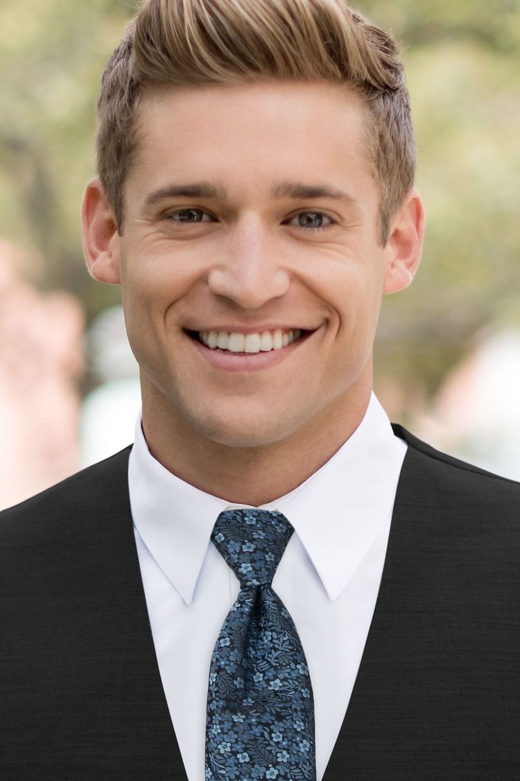 Man wearing a Floral Slate Blue Windsor Tie with a black vest