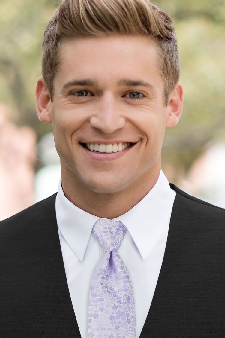 Man wearing a Floral Violet Windsor Tie in a black vest