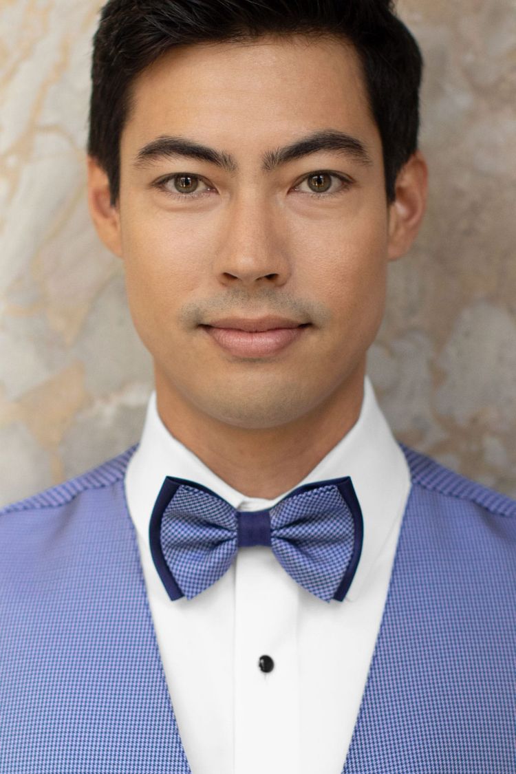 man wearing a Foundation Blue Bow Tie with a matching vest