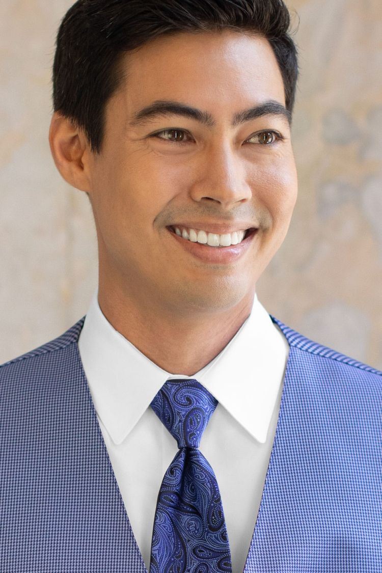 Man wearing a Foundation Paisley Blue Windsor Tie with a matching vest