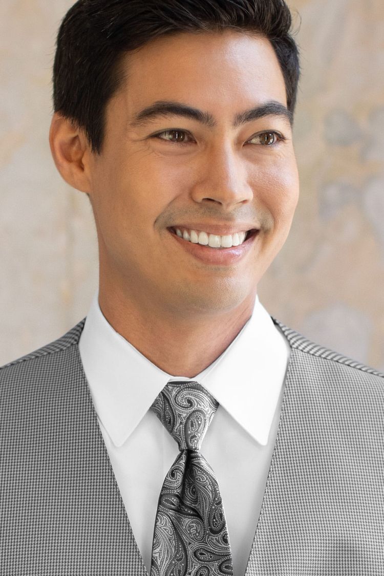 Man wearing a Foundation Paisley Heather Grey Windsor Tie with a matching vest