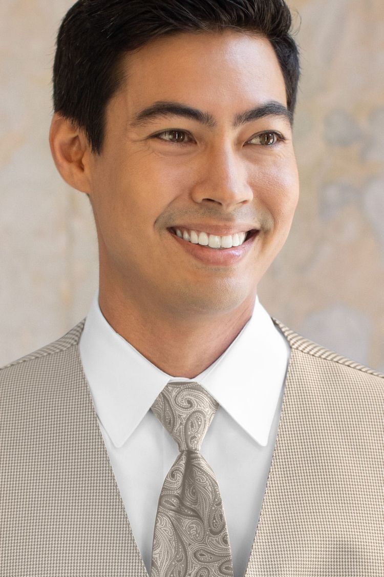 Man wearing a Foundation Paisley Sand Windsor Tie with a matching vest
