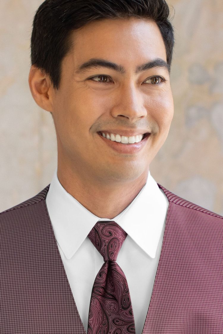 Man wearing a Foundation Paisley Wine Windsor Tie with a matching vest