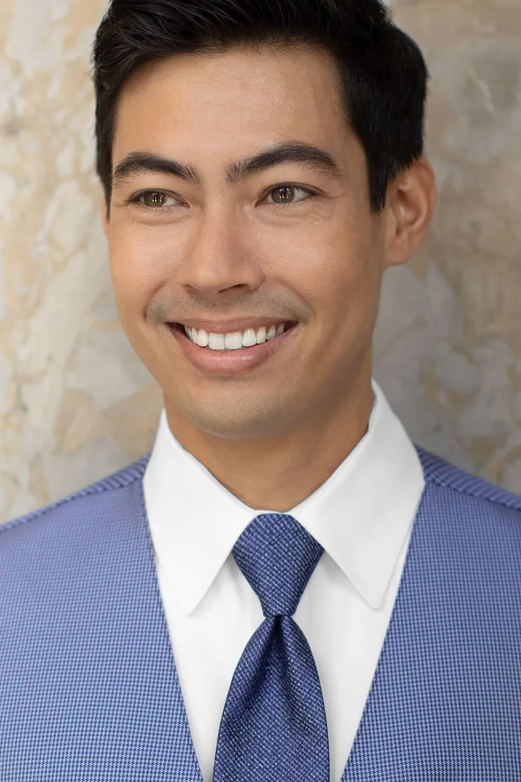 Man wearing a Foundation Woven Blue Windsor Tie with a matching vest
