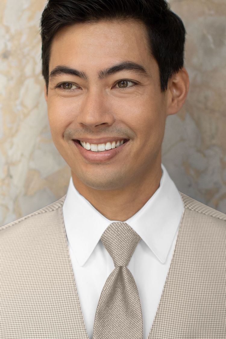Man wearing a Foundation Woven Sand Windsor Tie with a matching vest