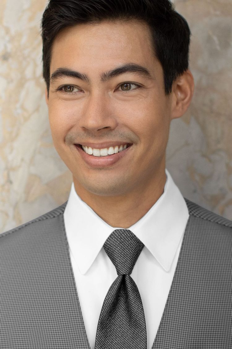 Man wearing a Foundation Woven Steel Grey Windsor Tie with a matching vest