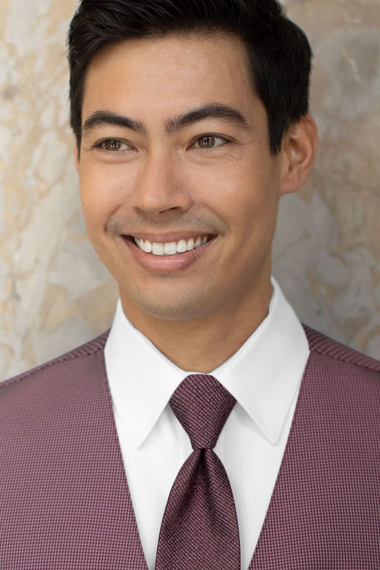 Man wearing a Foundation Woven Wine Windsor Tie and a matching vest