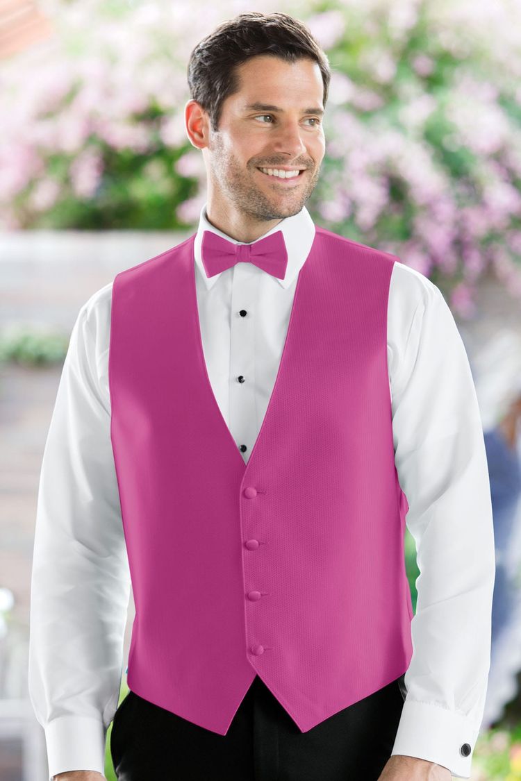 Man wearing the Herringbone Begonia Fullback Vest with a matching tie