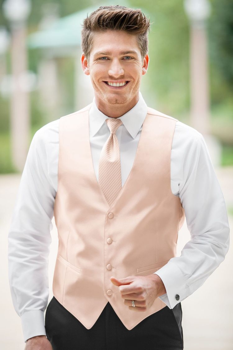 Guy wearing the Expressions Blush Fullback Vest and matching tie