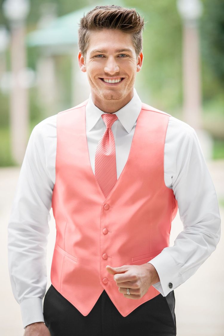 Guy wearing the Expressions Coral Fullback Vest and matching tie