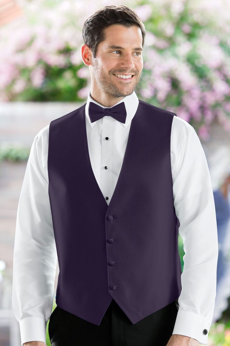 Man wearing the Herringbone Eggplant Fullback Vest with a matching tie
