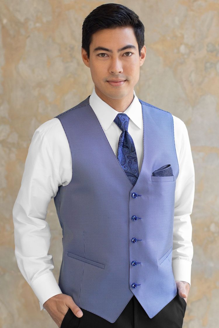 Guy wearing a Foundation Blue Fullback Vest and a matching tie