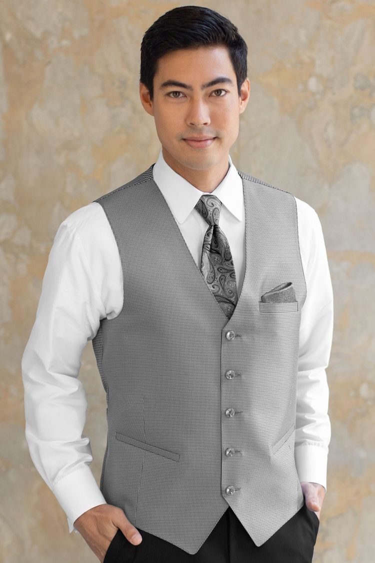 Guy wearing a Foundation Heather Grey Fullback Vest and a matching tie