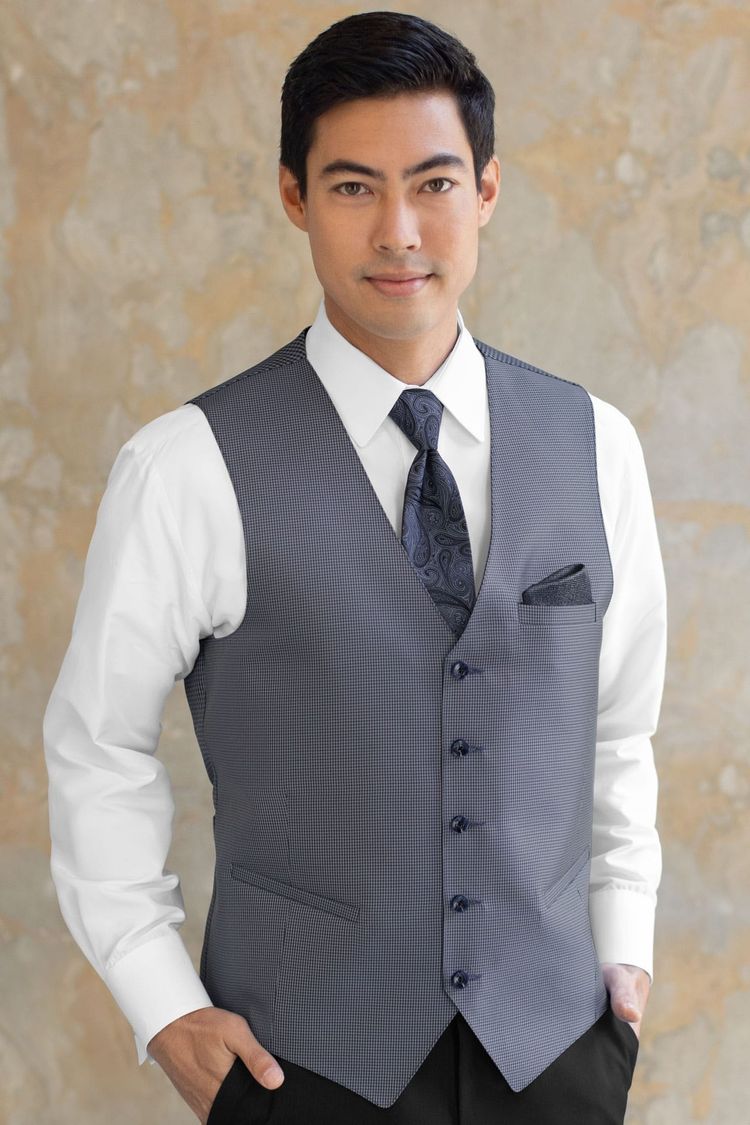 Guy wearing a Foundation Navy Fullback Vest and a matching tie