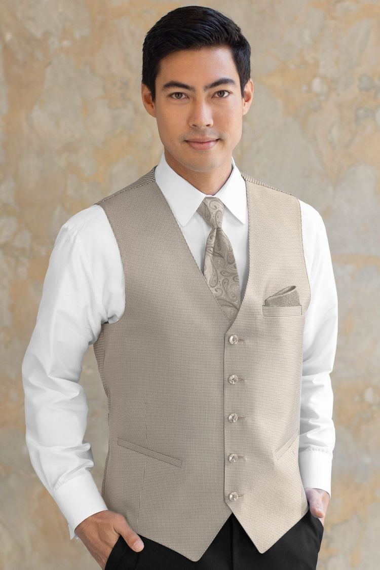 Guy wearing a Foundation Sand Fullback Vest and a matching tie