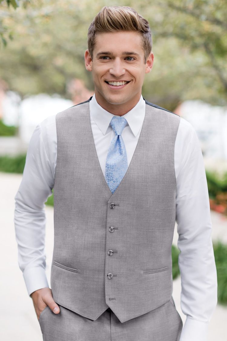 Guy wearing a Matching Heather Grey Fullback Vest and floral blue tie