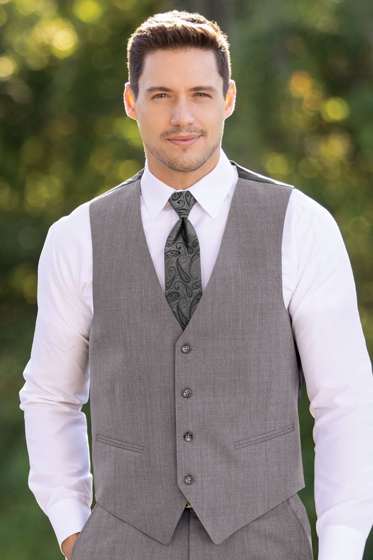 Man wearing the Michael Kors Medium Grey Performance vest with a coordinating Foundations grey windsor tie