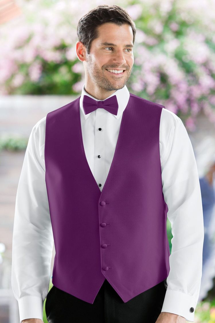 Man wearing the Herringbone Persian Plum Fullback Vest with a matching tie