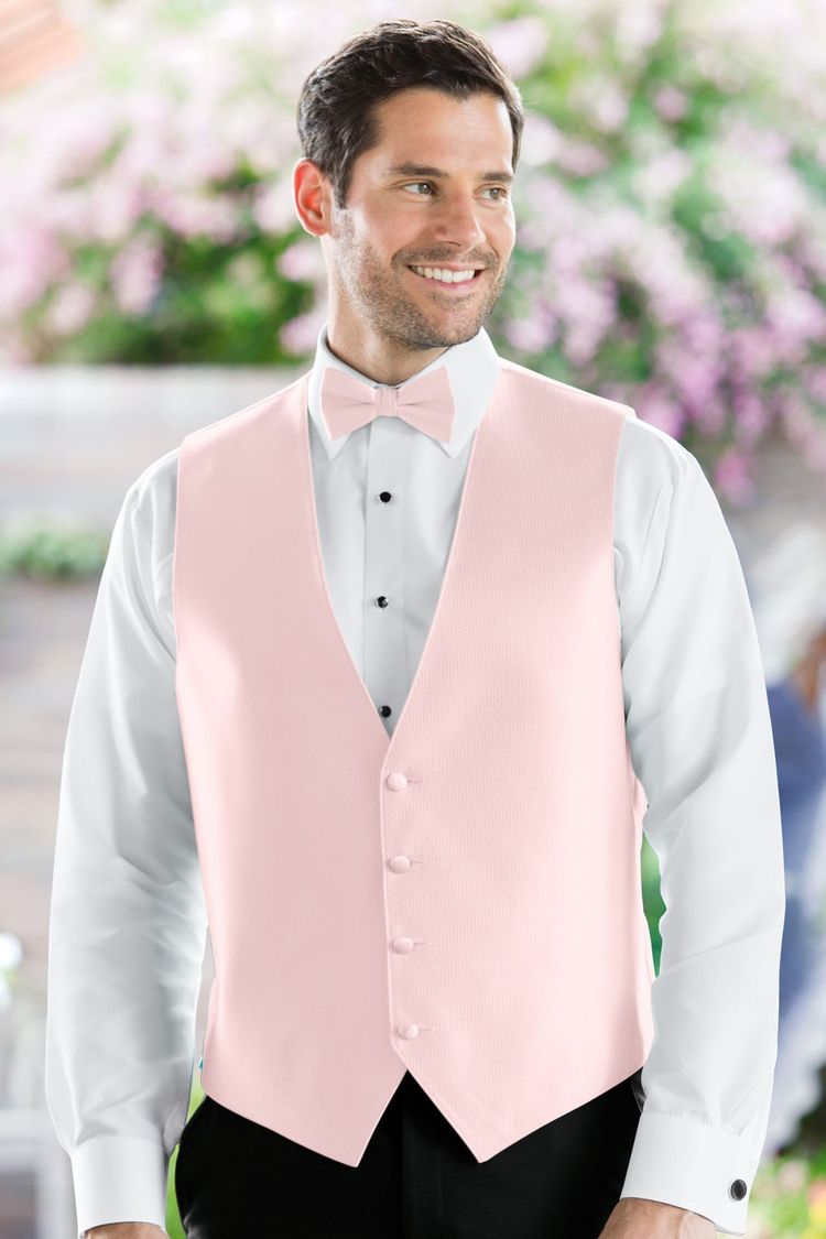 Man wearing the Herringbone Petal Pink Fullback Vest with a matching tie