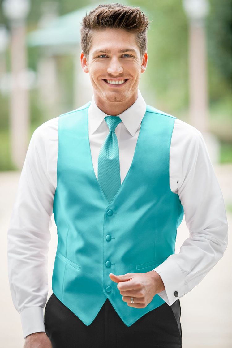 Guy wearing the Expressions Turquoise Fullback Vest with matching tie